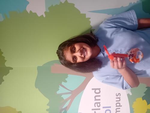 Pupil from Westmorland School showing off ornament