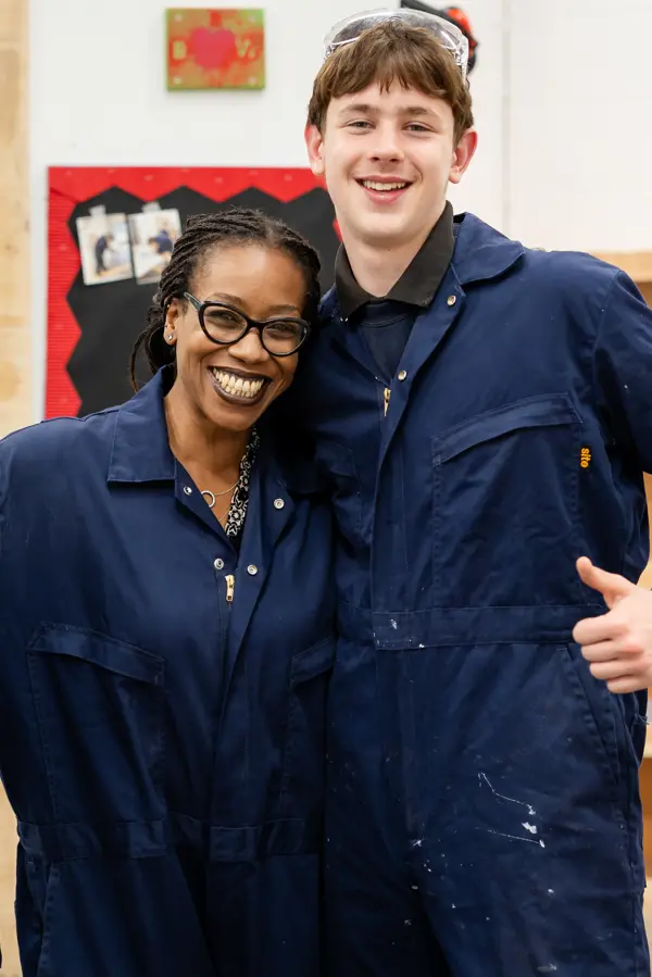 Two boys from Avon Park School stood with teacher in the DT room