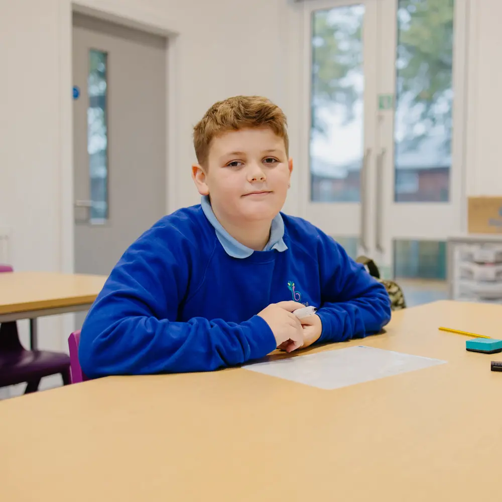 A young boy at Bescot Hall School working in a classroom