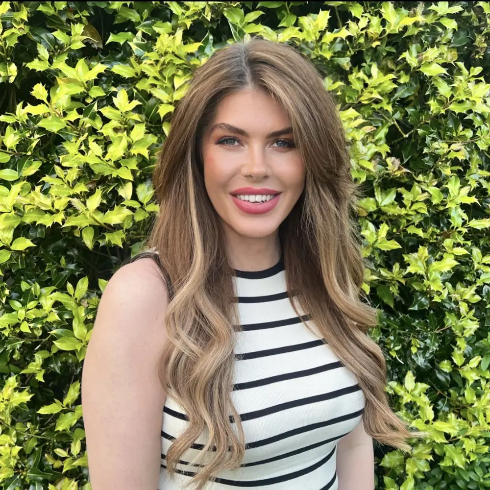 Portrait photograph of our Hilden Park Head Teacher smiling at the camera