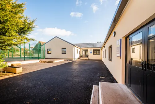 Outdoor courtyard at The Eaves Learning Centre on a sunny day