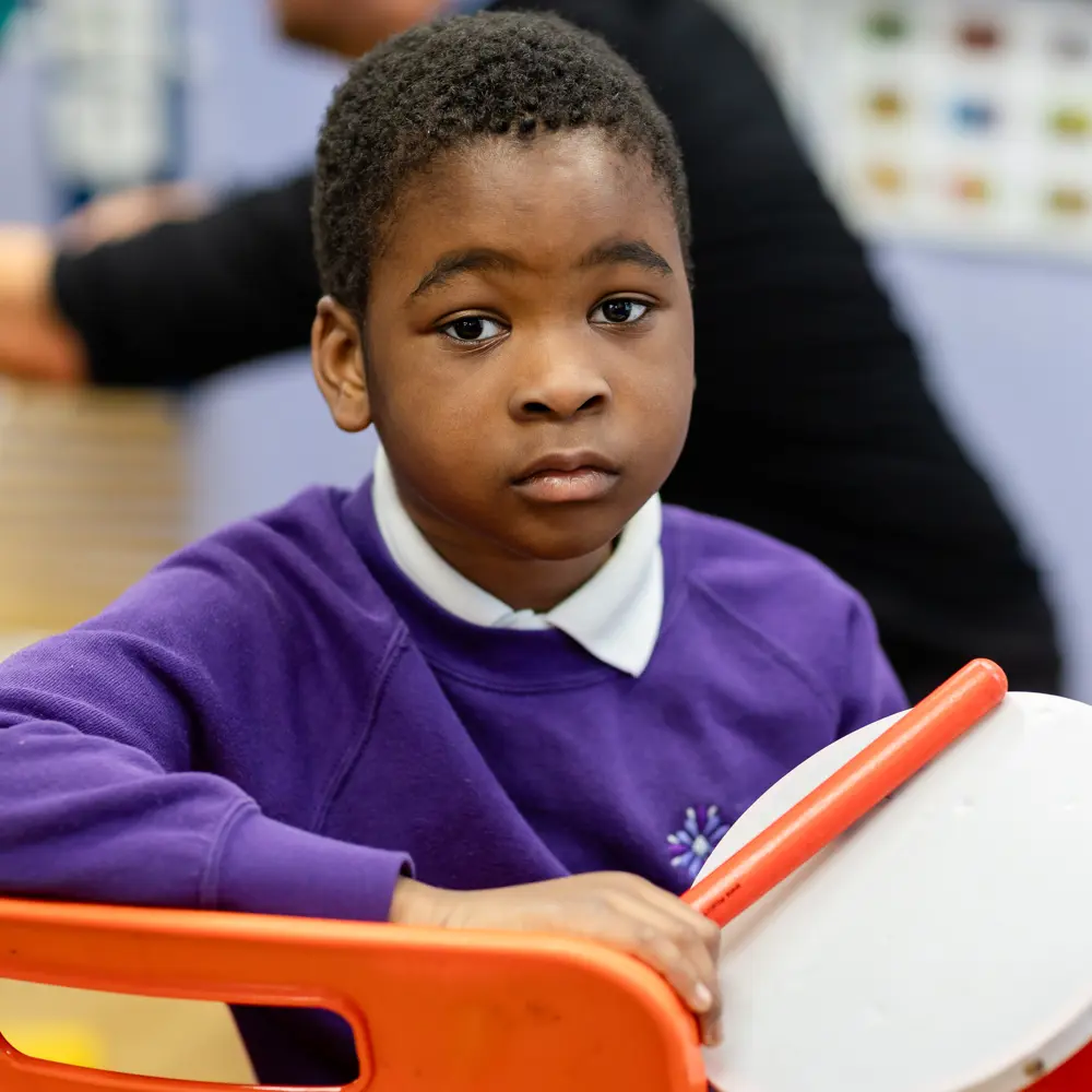 Young boy at Lavender Lodge School looking at the camera