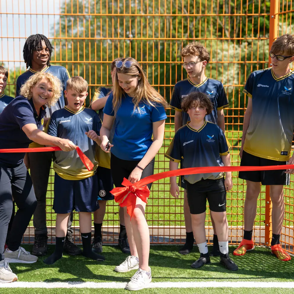 Pupils at Chilworth House Upper School cutting the opening ribbon for the new Cruyff Court