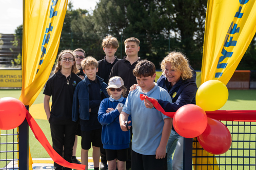 Children celebrating the opening of a Cruyff Court