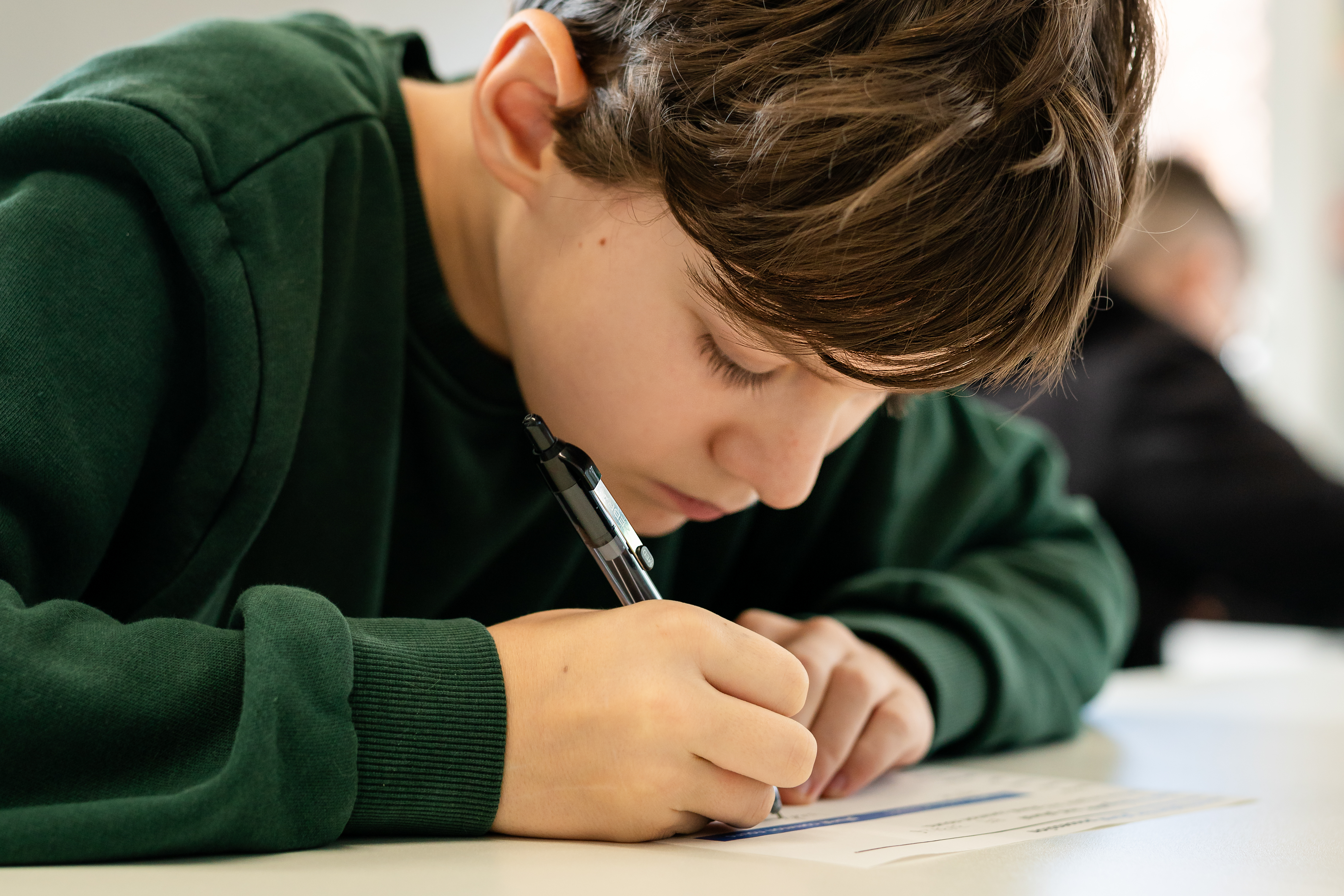Boy doing school work at desk