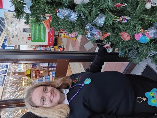 Pupil from Ashbrooke School proudly shows ornament