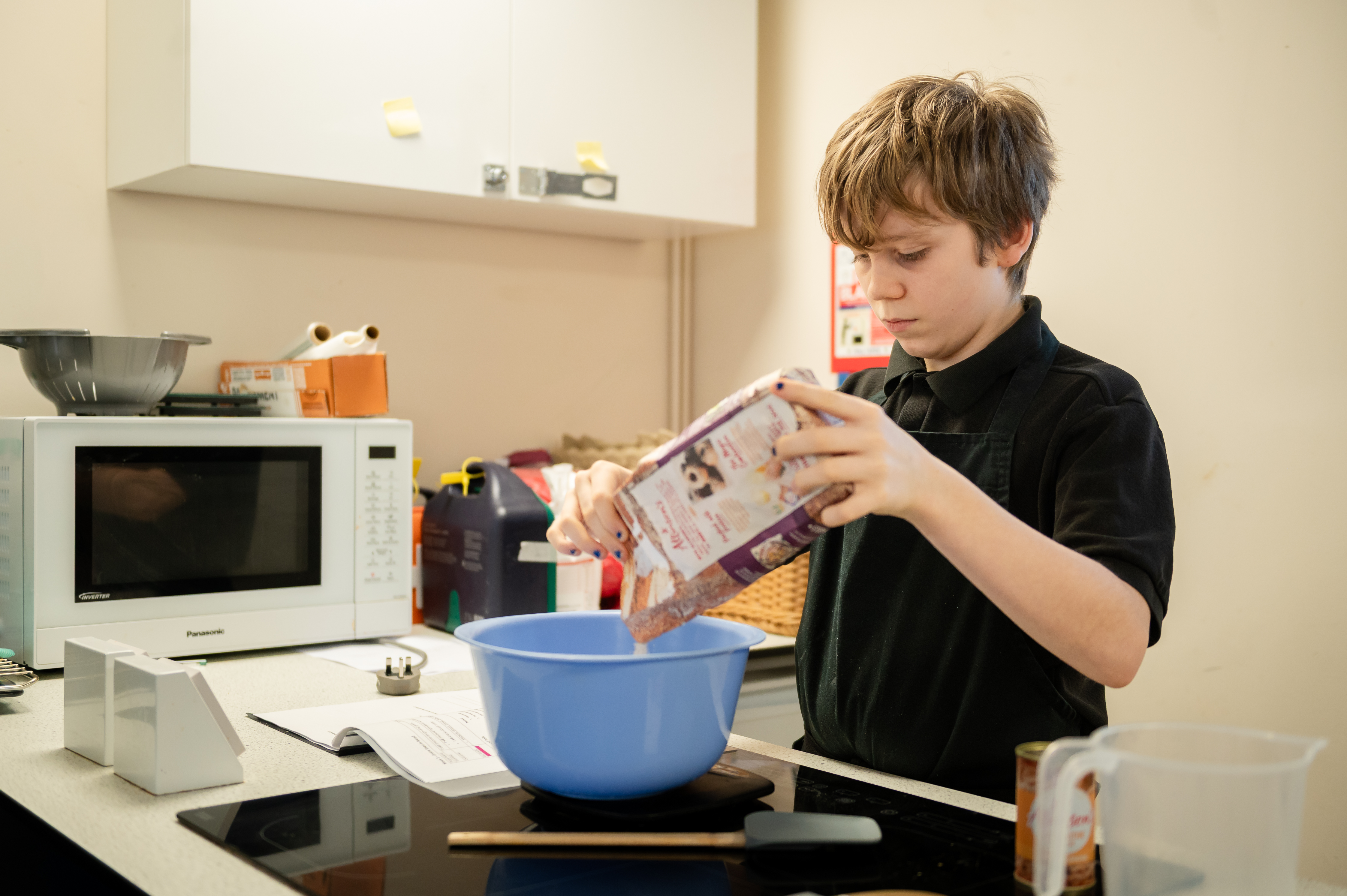 Boy from Castlfell school baking