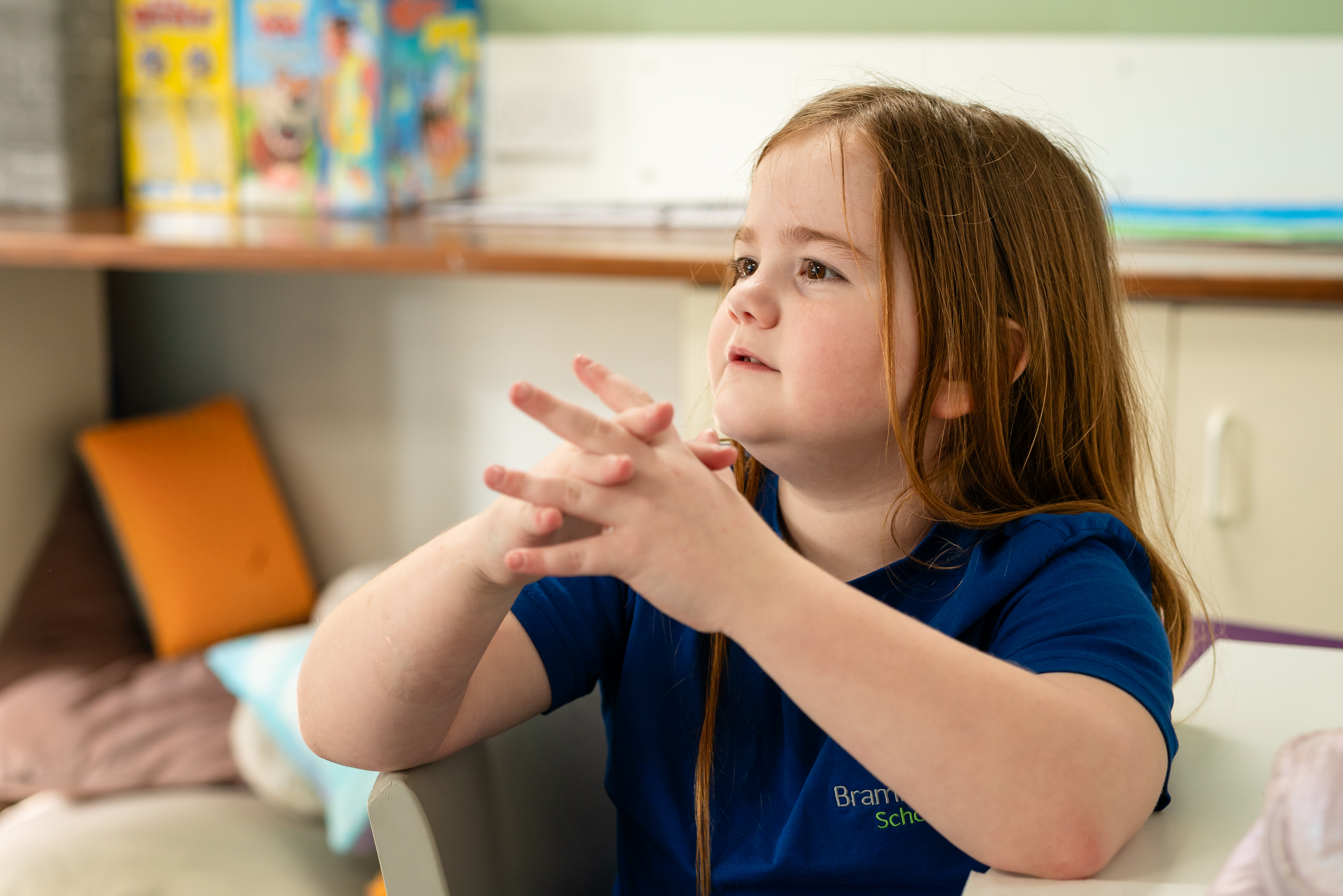 Young girl clapping hands together