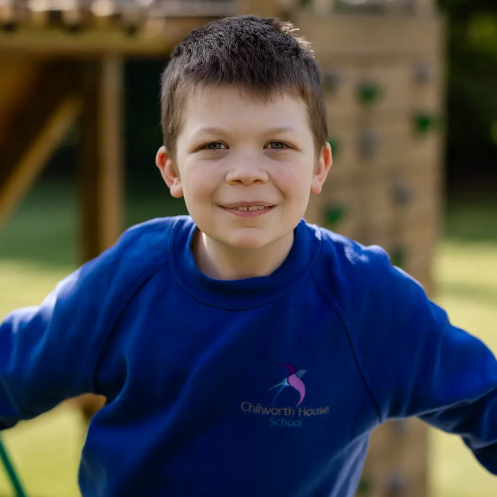 Boy from Chilworth House School playing on playground