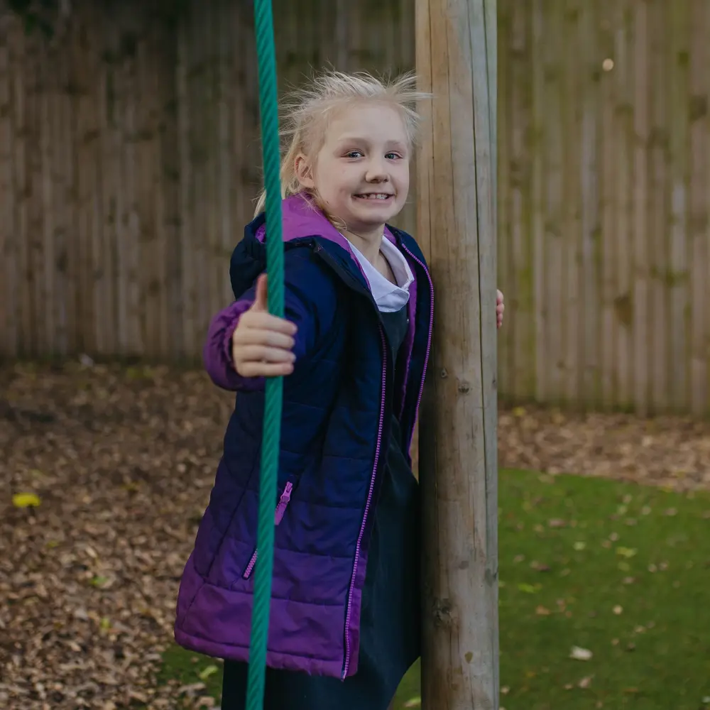 Young girl from Hall Cliffe Primary School playing on playground