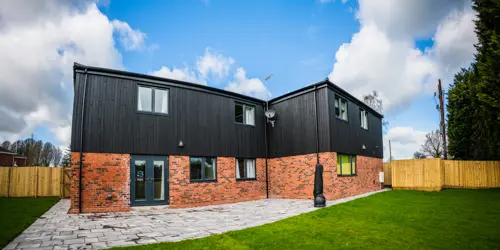 In the back garden of The Gables on a sunny day with freshly cut grass