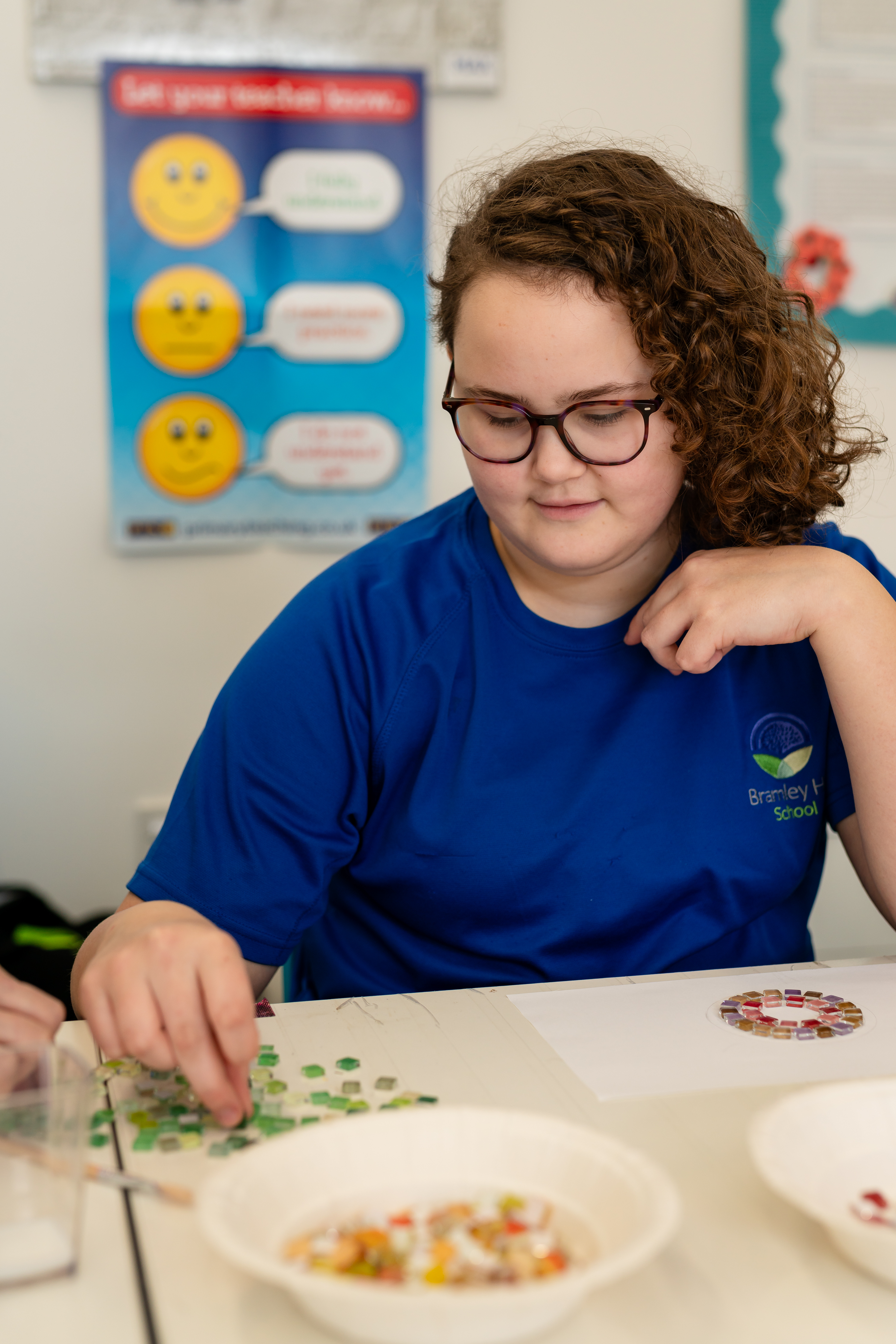 Girl playing with sequin tiles