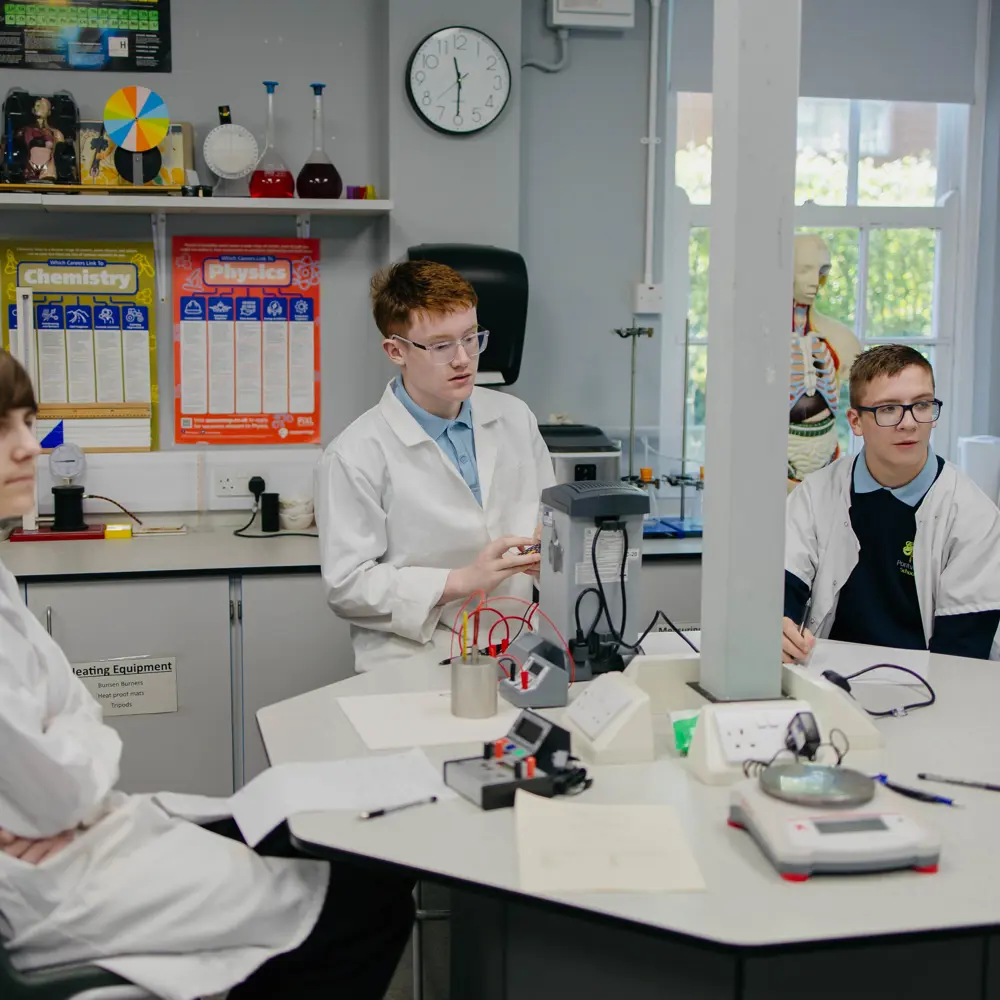 Three male pupils at Pontville School in a science lesson